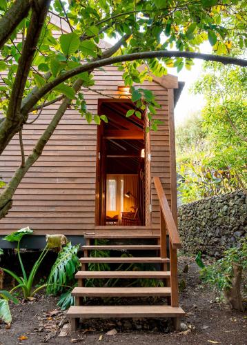 a small house with stairs leading to a window at Senhora da Rosa, Tradition & Nature Hotel in Ponta Delgada