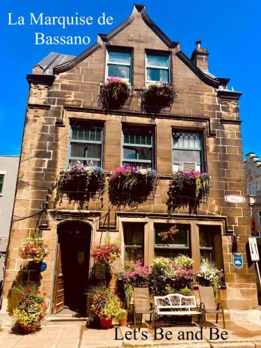 a building with flower boxes on the front of it at B&B Quebec in Quebec City