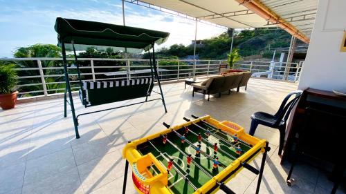 a pool table on the deck of a house at MarAzul, Casa grade familiar en Zorritos in Zorritos