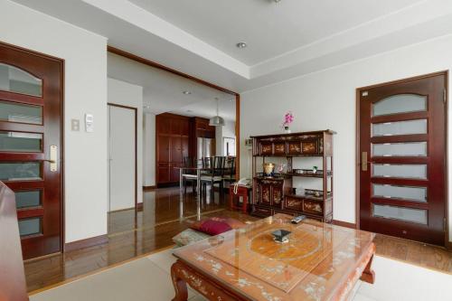 a living room with a glass table and a living room at KB1*Unique HUGE house for family /JR +subway in Osaka