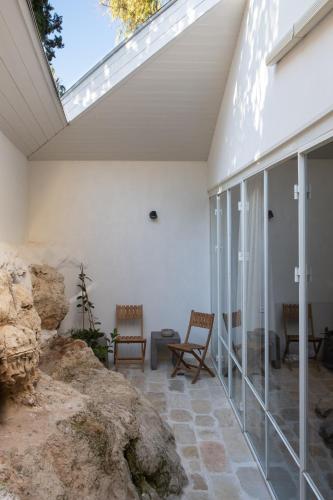a conservatory with a skylight on a house at Khan Ein Karem Boutique Hotel in Jerusalem