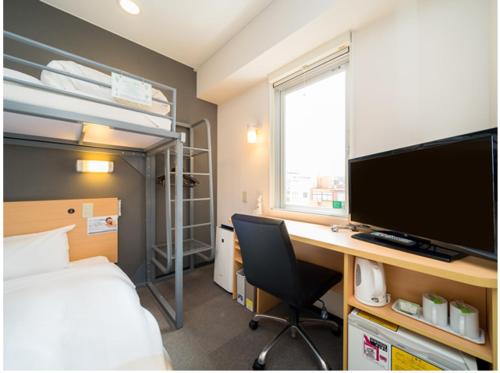 Postel nebo postele na pokoji v ubytování Super Hotel Yonago Ekimae