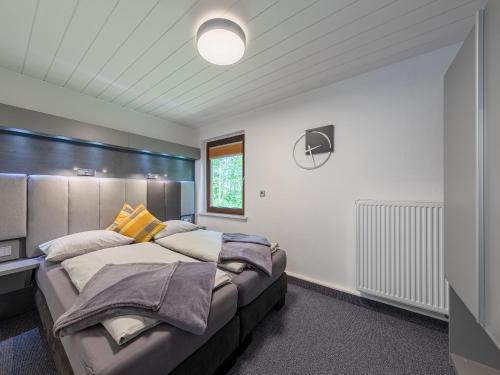 a bedroom with a large bed in a room at Paulshöhe in Waren