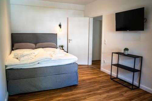 מיטה או מיטות בחדר ב-hygge Niederrhein
