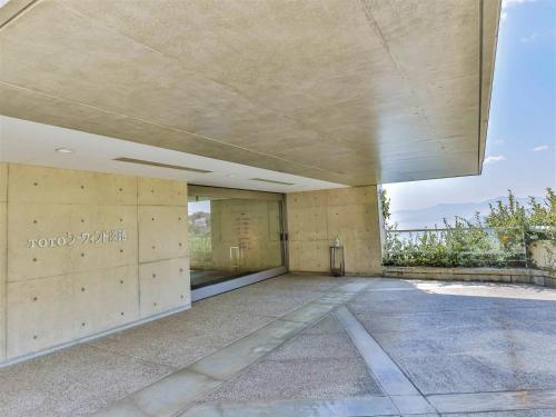 an external view of a building with a concrete wall at TOTO Seawind Awaji in Awaji