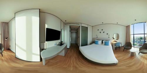 Ένα ή περισσότερα κρεβάτια σε δωμάτιο στο Lemon Tree Hotel, Jumeirah Dubai