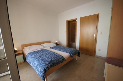 Posteľ alebo postele v izbe v ubytovaní Apartment 75-5