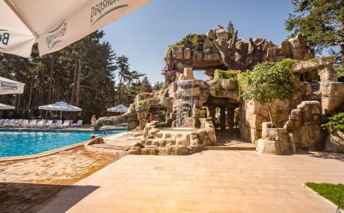 a pool at a resort with a water park at Spa Hotel Dvoretsa in Velingrad