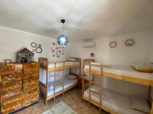 Una cama o camas en una habitación de The Hood - Shkodra Backpackers Hostel & Day Tours