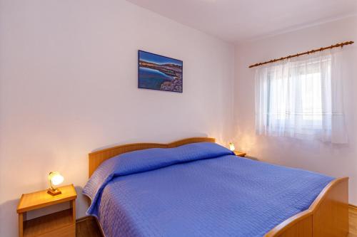 Postel nebo postele na pokoji v ubytování Holiday House Emma