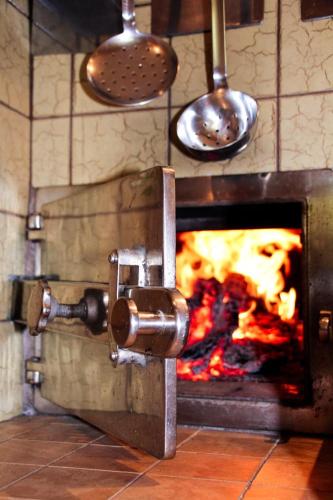 a oven with a fire inside of it at Hus 172 in Gaschurn
