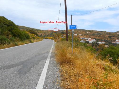 an empty road with a sign on the side of it at AEGEAN VIEW in Kochilos