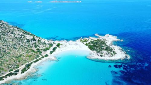 an aerial view of an island in the ocean at Appartamento Fonny Best Vacation Ever Villasimius in Villasimius