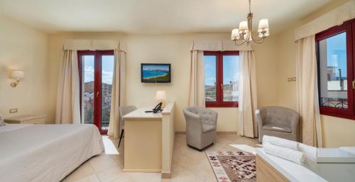 Postel nebo postele na pokoji v ubytování Hotel Regina Elena