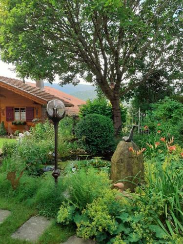 a garden with a light in the middle of a yard at Ferienwohnung Arberblick in Lam