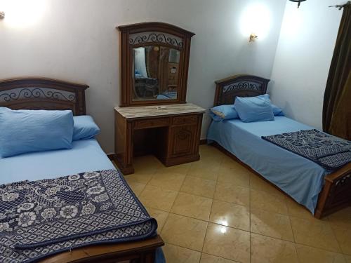 En eller flere senger på et rom på Chalet Palmera resort ain Sukhna-egypt