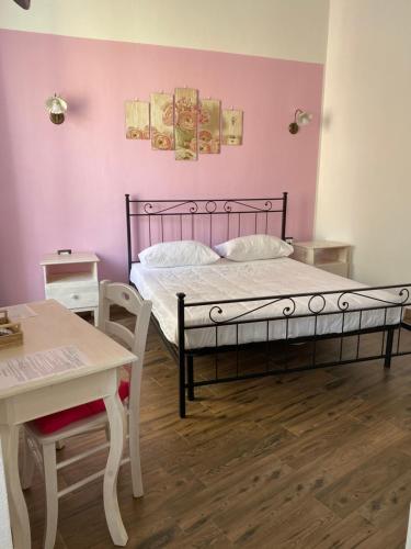 Postel nebo postele na pokoji v ubytování Dani's House - affittacamere nel cuore di Cagliari