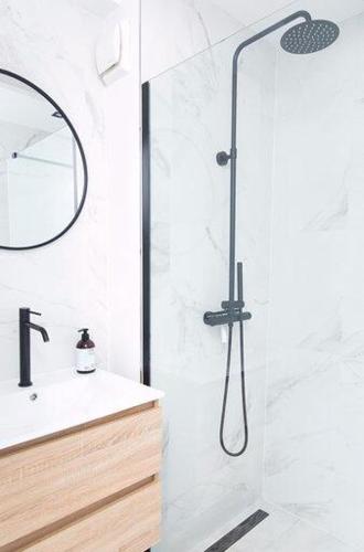 a bathroom with a shower with a sink and a mirror at Trendy 2 bedroom accommodation on perfect location in Amsterdam