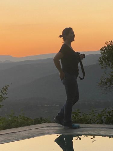 a woman standing on the edge of a mountain at Ashbourne Country Escape Hazyview in Hazyview
