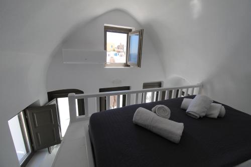 Postel nebo postele na pokoji v ubytování Astrea Suites Notus Dome House