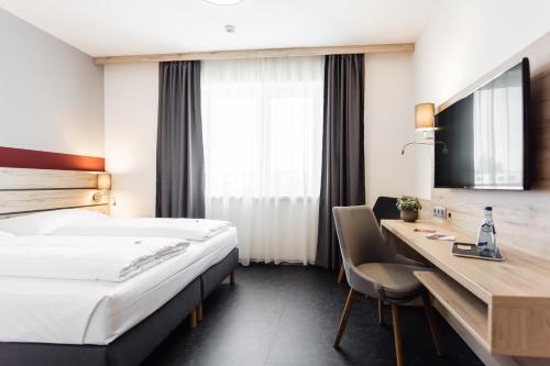 Posteľ alebo postele v izbe v ubytovaní Hotel Smart Liv'in