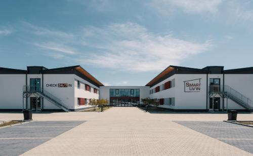 a row of buildings in a parking lot at Hotel Smart Liv'in in Böheimkirchen