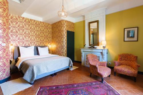 En eller flere senger på et rom på Logement Onze Chambres & Gîtes