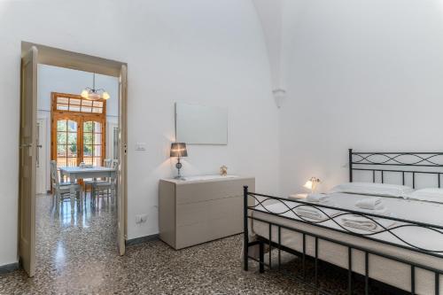 Postel nebo postele na pokoji v ubytování IL GIARDINO DEL MANDARINO HOUSE