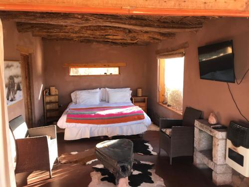 Кровать или кровати в номере Eco-Lodge El Andinista