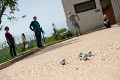 a group of three silver balls on a golf course at La Ferme du Cayla in Linac