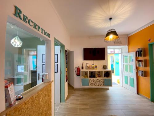 a hallway of a store with a display case at Orange Terrace Hostel in Albufeira