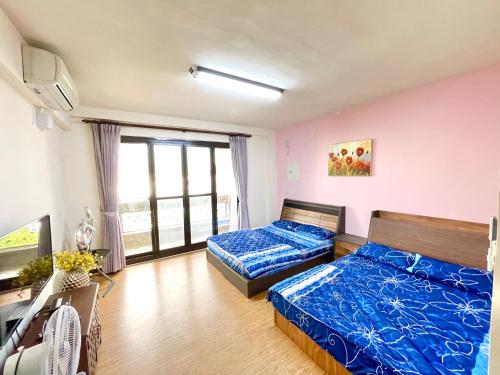 Voodi või voodid majutusasutuse Qilixiang Homestay toas