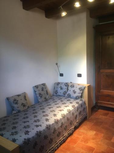Un pat sau paturi într-o cameră la La Cella Lizzano