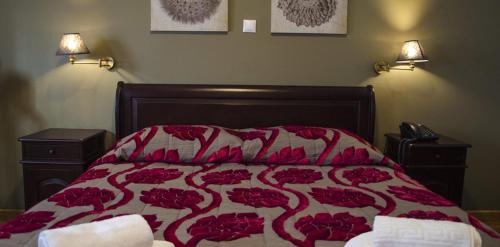 En eller flere senge i et værelse på Κleio Resort And Spa