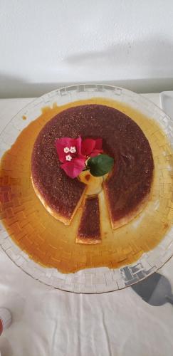 a chocolate cake on a plate on a table at Pousada Varanda do Sol in Arraial d'Ajuda