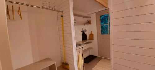 a bathroom with a shower and a sink in it at Kempings Saulkrastos in Saulkrasti