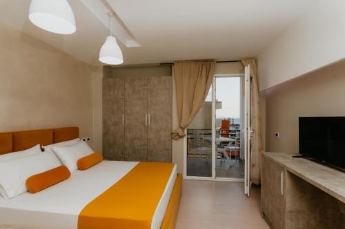 Postel nebo postele na pokoji v ubytování Hotel Miki