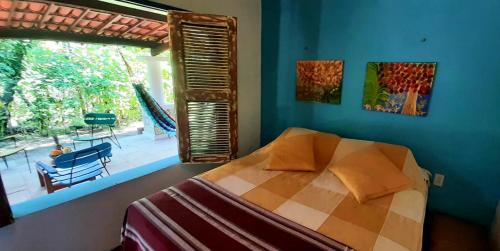 Un pat sau paturi într-o cameră la Chalé Aroeira Taiba