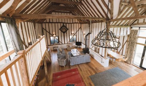 an overhead view of a living room in a barn at Partridge Lodge Self Catering houses in Woodbridge