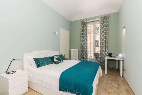 Postel nebo postele na pokoji v ubytování Appartamento nel cuore di Crocetta by Wonderful Italy