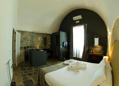 Postel nebo postele na pokoji v ubytování Silos19 Suites