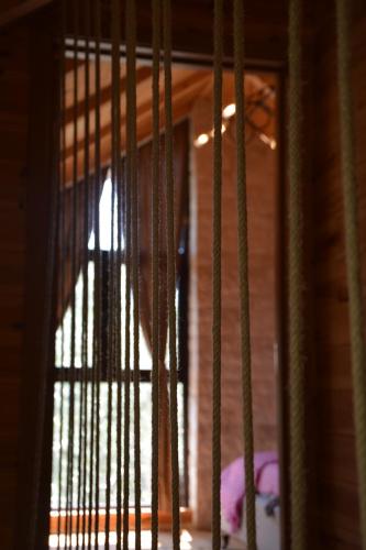 a view of a window with bars on a door at OLEA COTTAGE in Ulcinj
