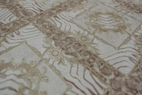 a close up of a white and brown tile floor at Miryam House Affittacamere Suite e Relax in San Severo