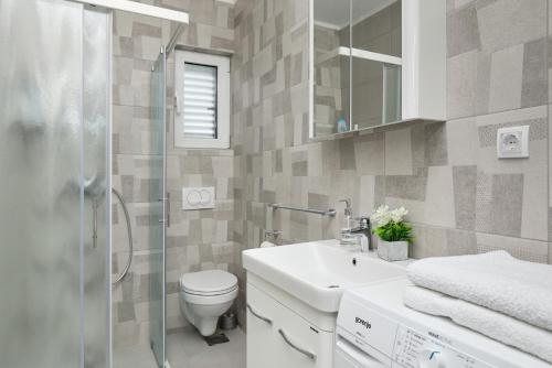 Ein Badezimmer in der Unterkunft Apartment Kascelan