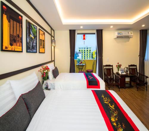 Postel nebo postele na pokoji v ubytování Hoi An Riverland Villa - Hoi An Center