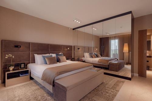 Postel nebo postele na pokoji v ubytování ONE Luxury Apartments