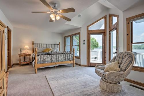 a bedroom with a bed and a ceiling fan at Sunny Providence Cottage Retreat with Dock, Kayaks in Sunrise Beach