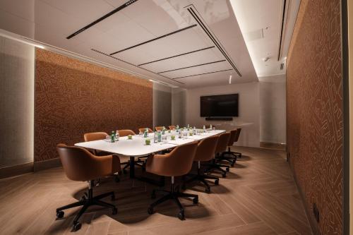 a conference room with a long table and chairs at Hyatt Regency Malta in St Julian's