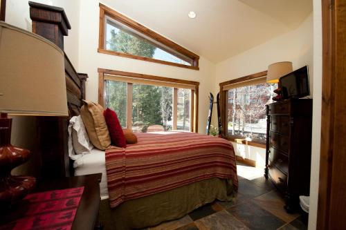 a bedroom with a bed and a window at Peregrine Point 201 in Durango Mountain Resort