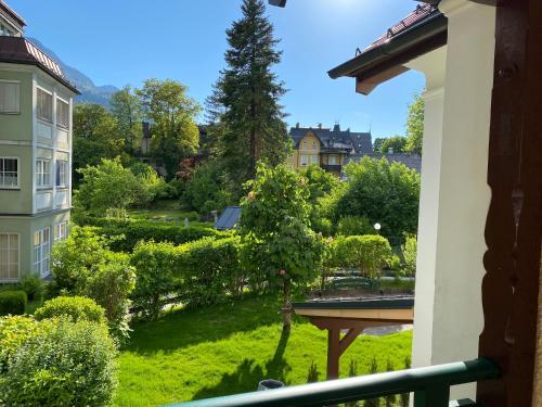 a view of a garden from a balcony at Im Kurpark in Bad Ischl